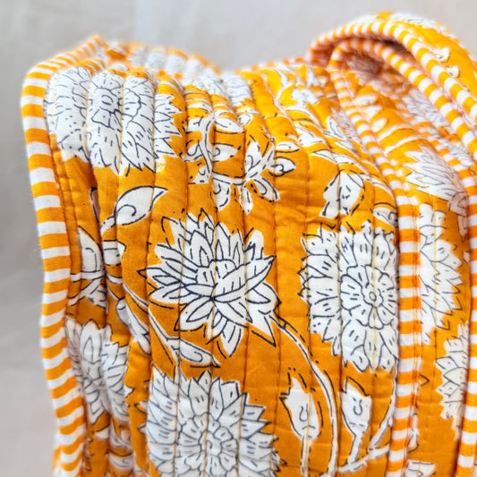 Mustard-gold floral print quilted cotton duffel bag for travel