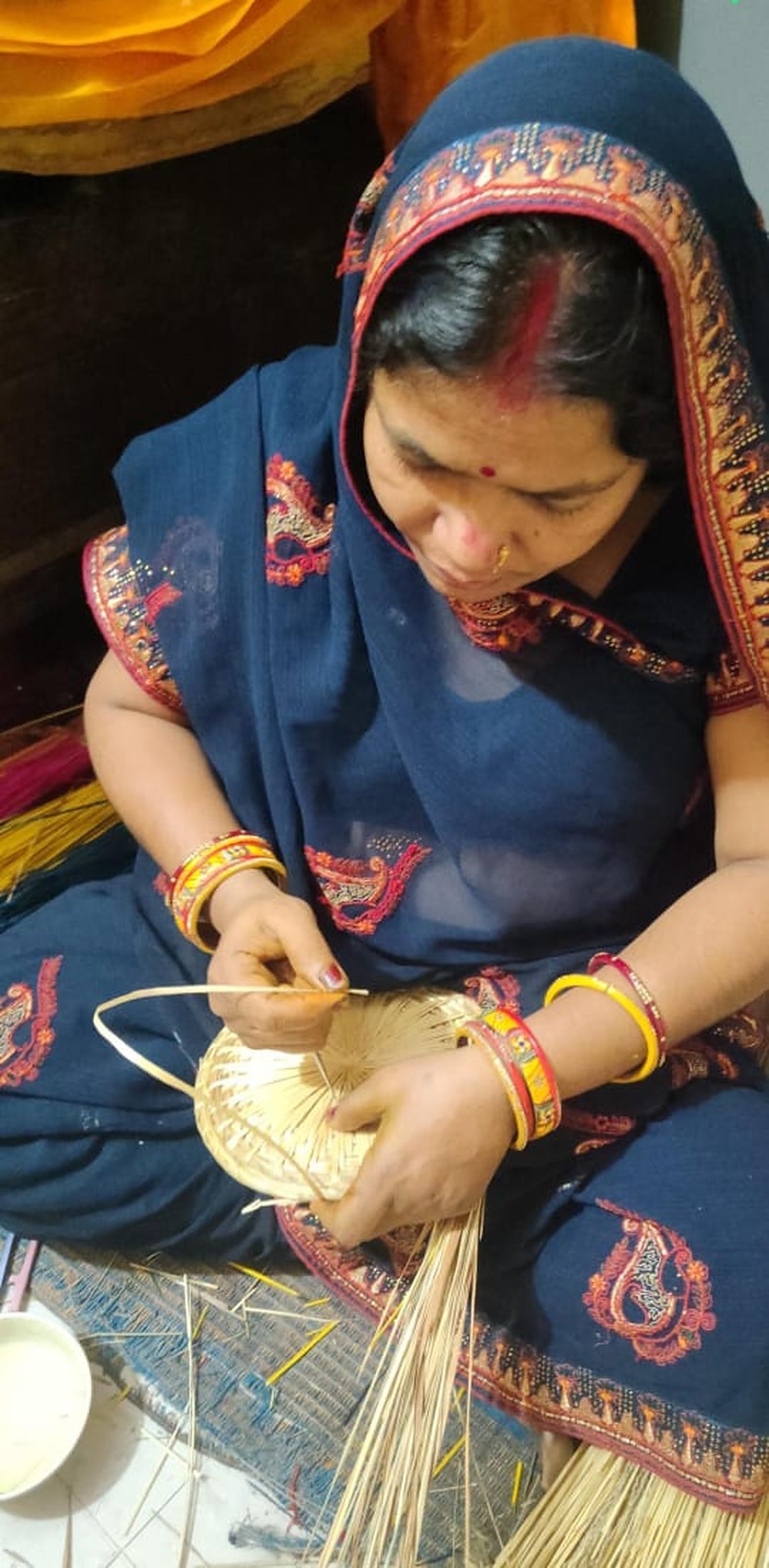 Artisan creating traditional Sikki grass craft in Bihar