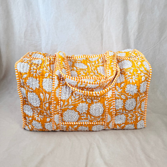 Mustard-gold floral print quilted cotton duffel bag for travel
