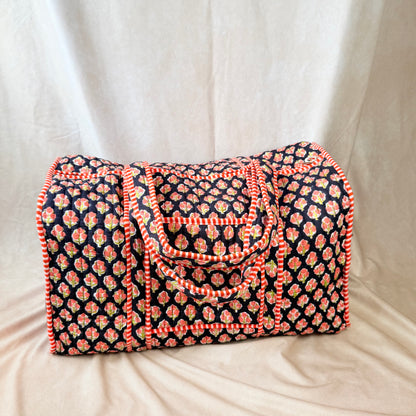 Black and orange floral print quilted cotton duffel bag