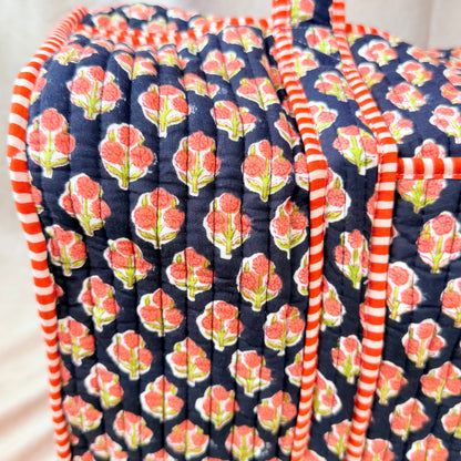 Black and orange floral print quilted cotton duffel bag
